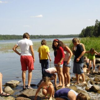 People gather to play in the water at the local park.