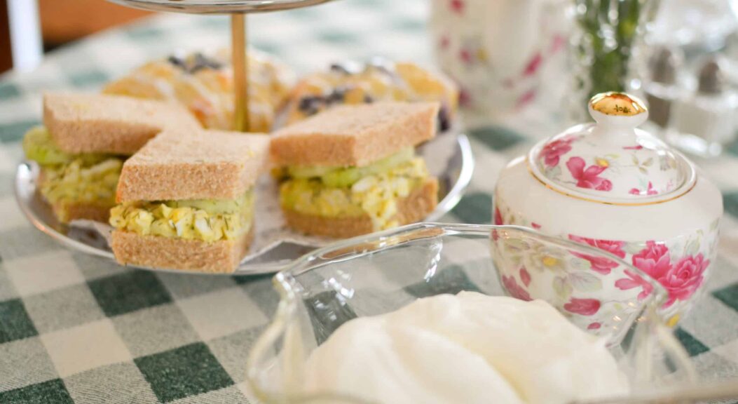 English tea hour has egg salad sandwiches and cookies